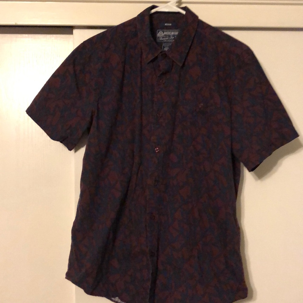 Red and dark blue collared button down shirt
